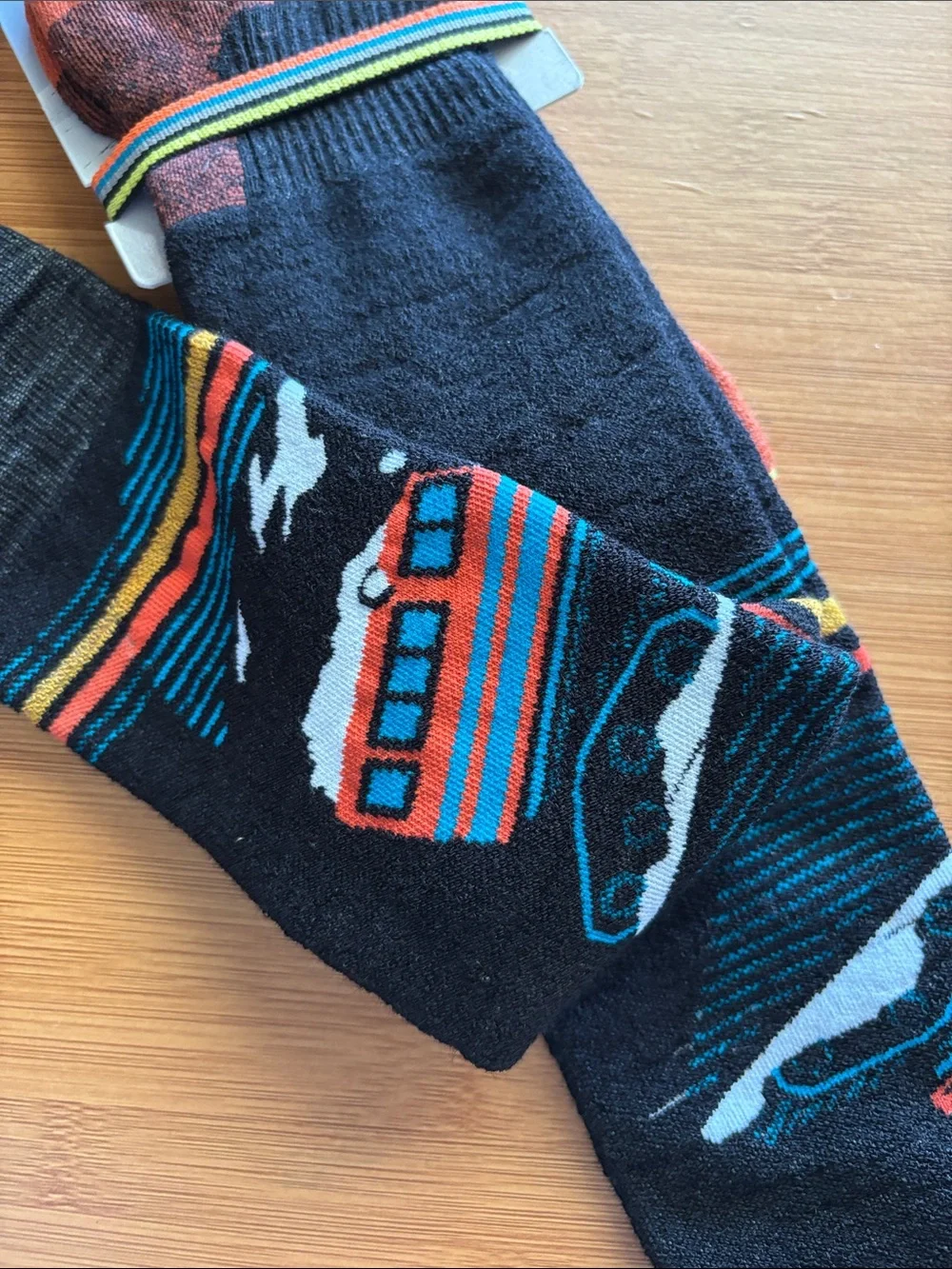 Smartwool Men's Black Snow Socks with Orange Teal and White Ski Bus Pattern